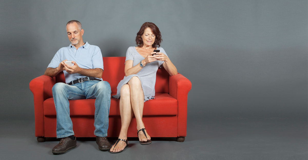 Two wedding - compromise rings surrounded blue lines on a reflecting surface. Light painting. Conceptual Nature.