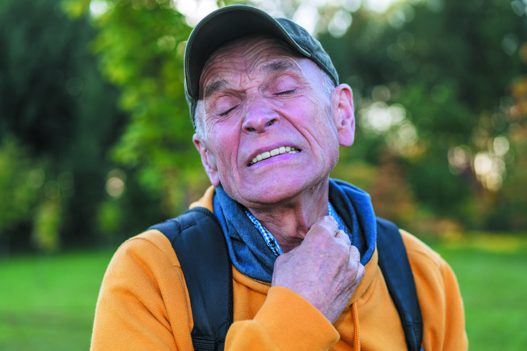 old man with pain on face hold and touch your neck after mosquito bite