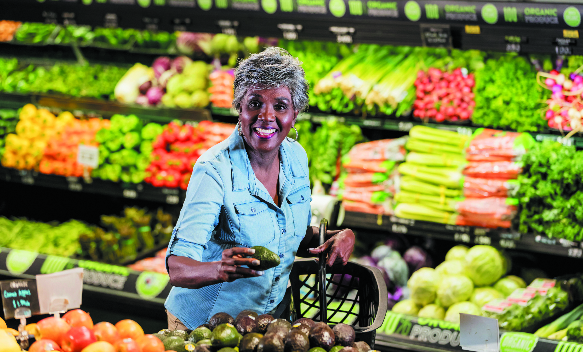 Senior African American woman shopping for produce in supermarket