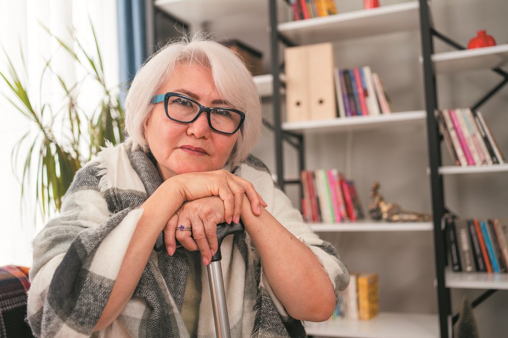 Elderly woman looking pensive