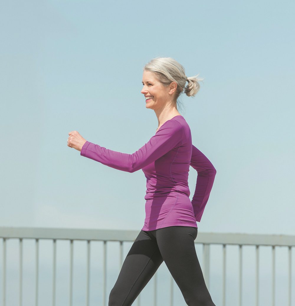 USA, New Jersey, Jersey City, Senior woman walking