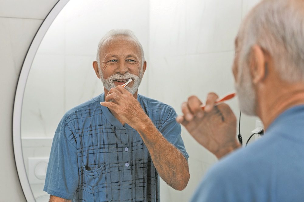 Senior man keeping their dental hygiene