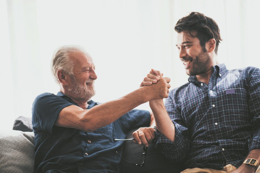 Young Man Sitting On Stage