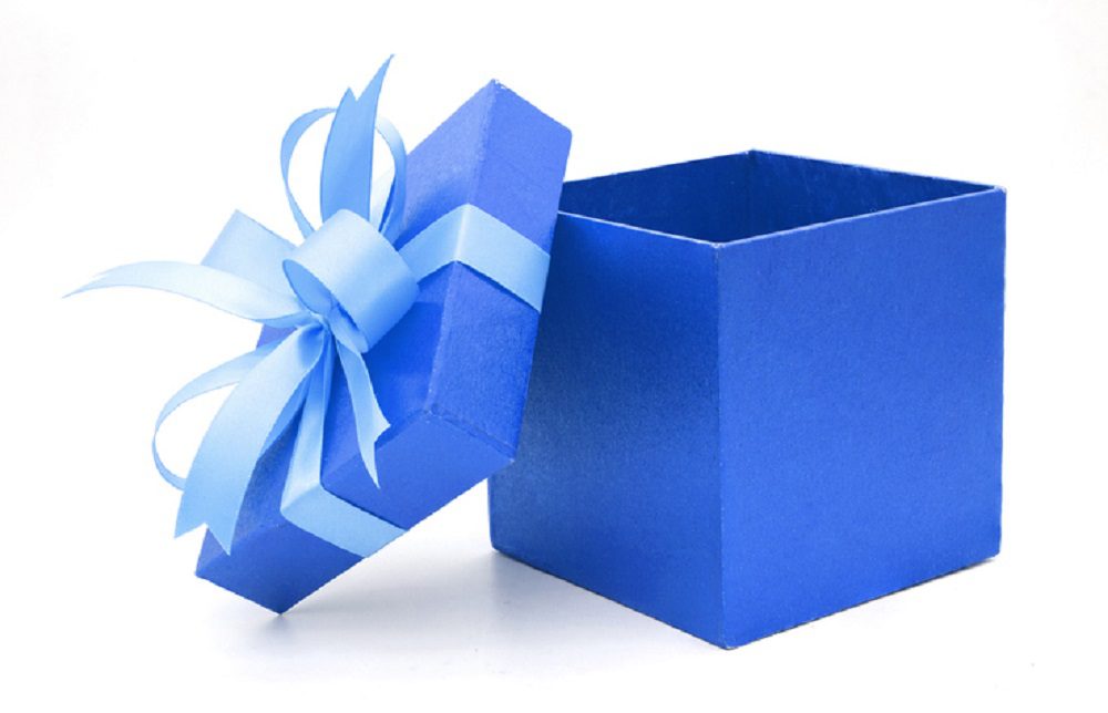 Close-Up Of Blue Gift Box Against White Background