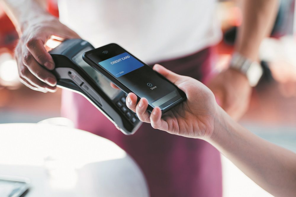 Paying With Mobile Phone At Restaurant