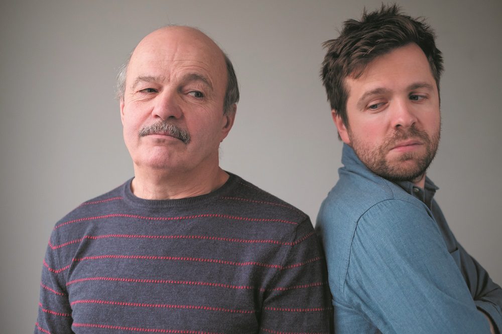 Mature caucasian man and son are offended on each other.