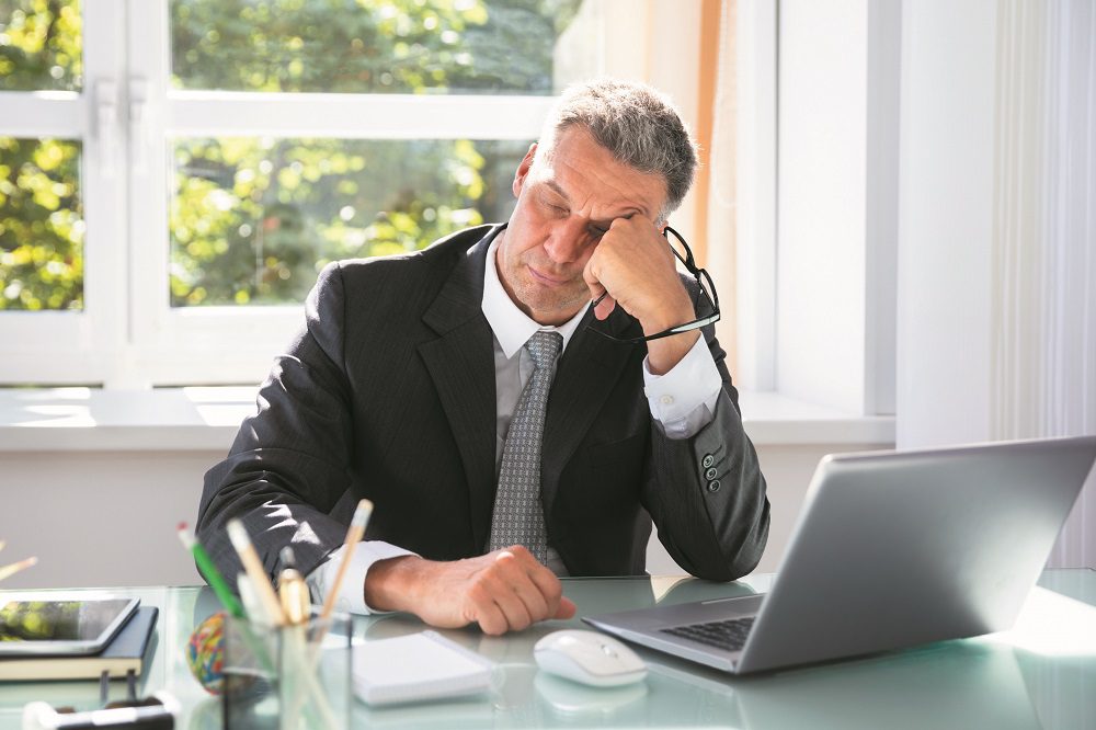 Businessman Sleeping In Office