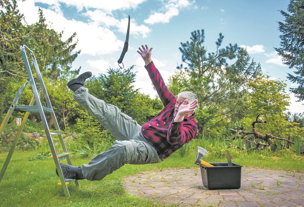 Senior Man Falling From Ladder In Garden