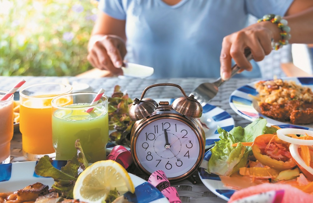 Alarm clock with IF (Intermittent Fasting) 16 and 8 diet rule and weight loss concept.-Diet plan concept