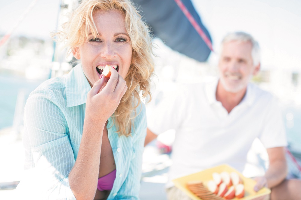 Woman eating apple