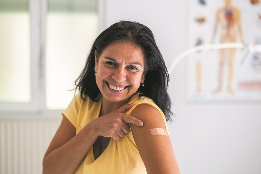 Woman happy after getting covid-19 vaccination