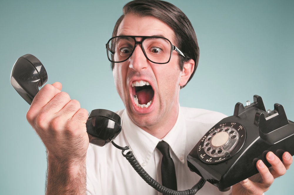Nerdy Office Worker With Vintage Telephone