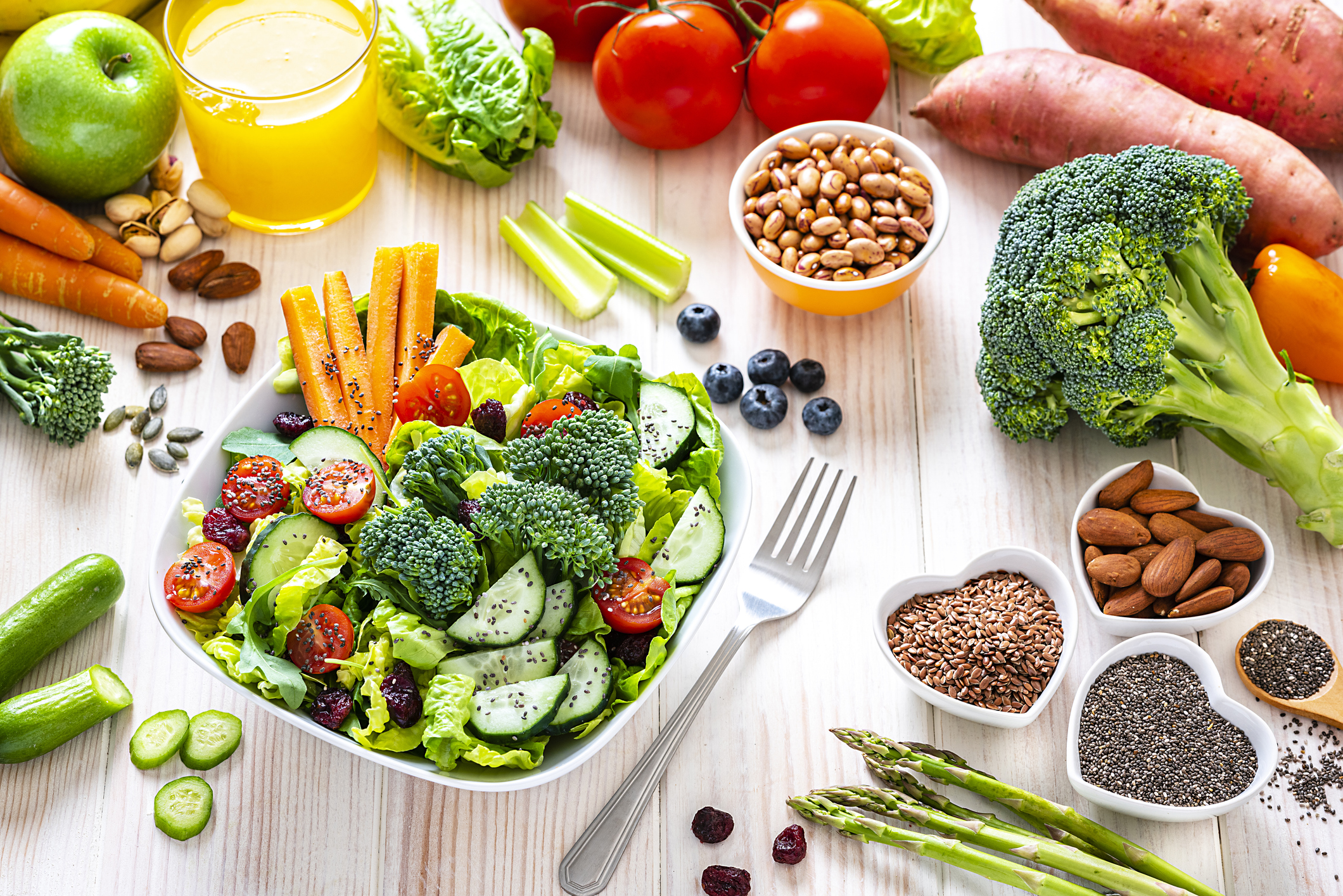 Vegan food: healthy salad plate on white table.