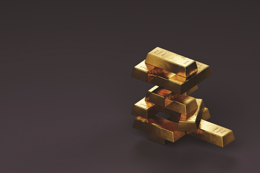 Stack of gold ingot on purple background with space for text.