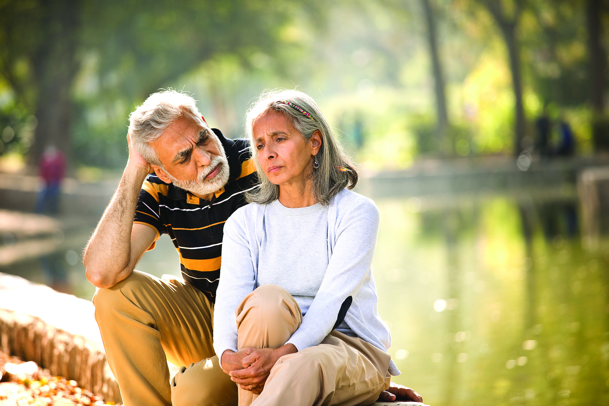 Senior man consoling his angry wife