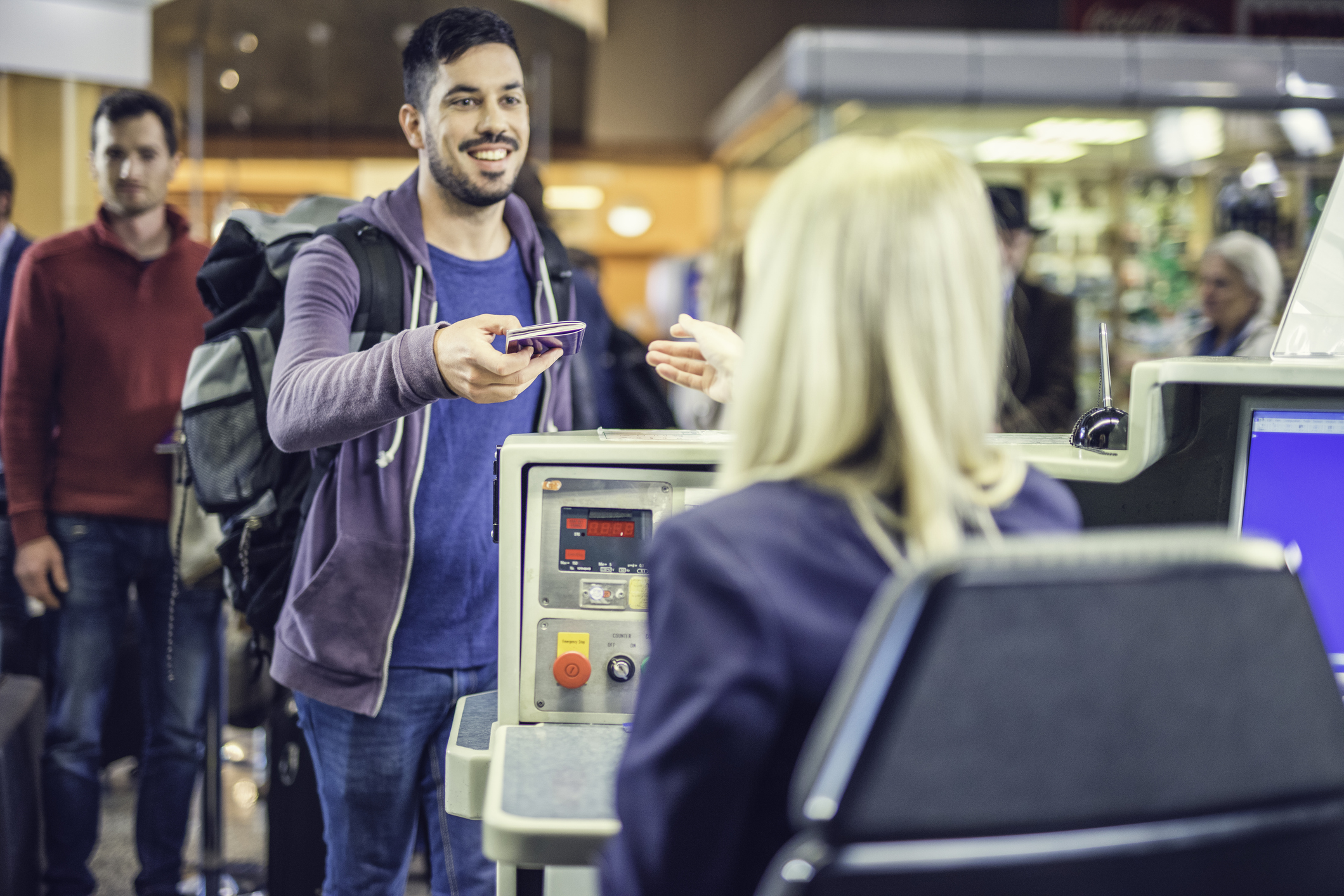 Businessman with passport at airport