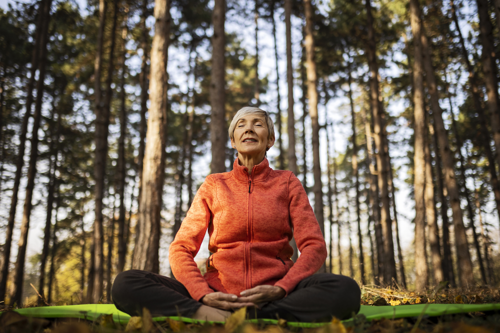 Senior woman practicing yoga workout routine