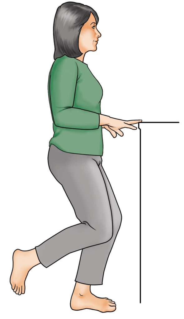 A diagram of a woman using a piece of furniture to balance herself as she raises a single leg as part of a single leg stand exercise.